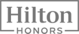 The image shows the Hilton Honors logo, featuring the text "Hilton Honors" in a rectangular border.